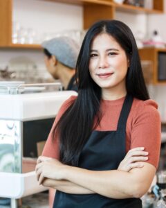 Coffee Shop Owner standing in her coffee shop